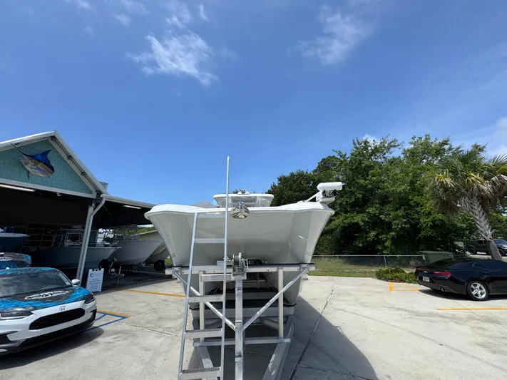 Yacht Photos Pics 2022 Twin Vee 340 GFX CC boat on display under clear blue sky.