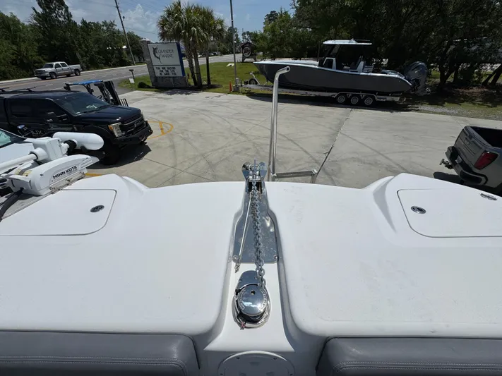  Yacht Photos Pics 2022 Twin Vee 340 GFX CC boat deck with anchor chain and parked vehicles.