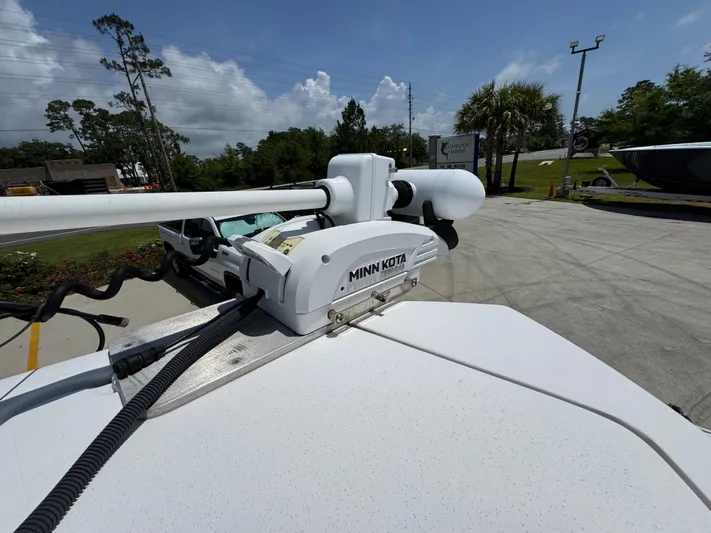  Yacht Photos Pics 2022 Twin Vee 340 GFX CC with Minn Kota trolling motor in a sunny outdoor setting.