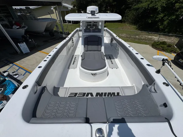  Yacht Photos Pics 2022 Twin Vee 340 GFX CC boat interior with seating and console.
