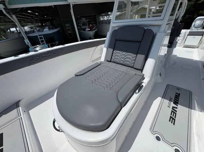 Yacht Photos Pics 2022 Twin Vee 340 GFX CC boat with sleek gray seating and modern design.