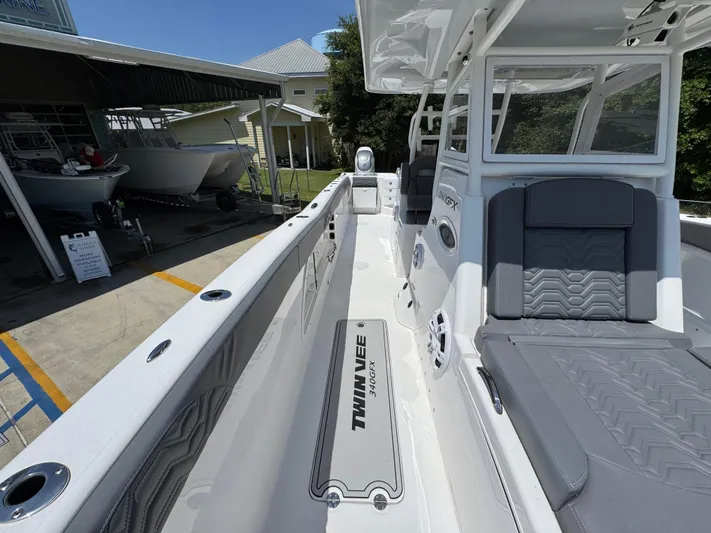  Yacht Photos Pics 2022 Twin Vee 340 GFX CC boat interior with seating and deck view.