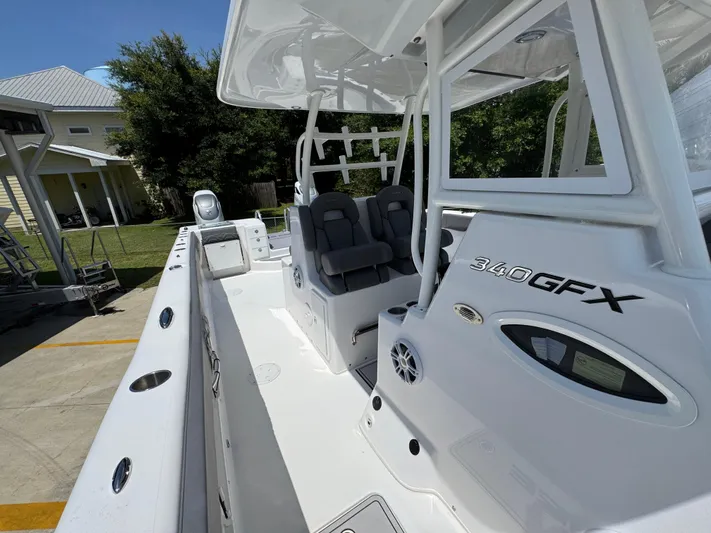  Yacht Photos Pics 2022 Twin Vee 340 GFX CC boat interior with seating and console details.