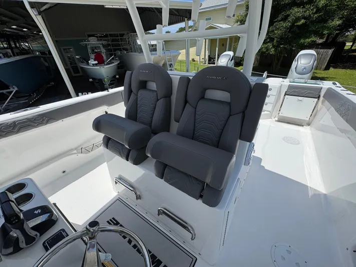  Yacht Photos Pics 2022 Twin Vee 340 GFX CC boat with dual cushioned seats and modern helm.
