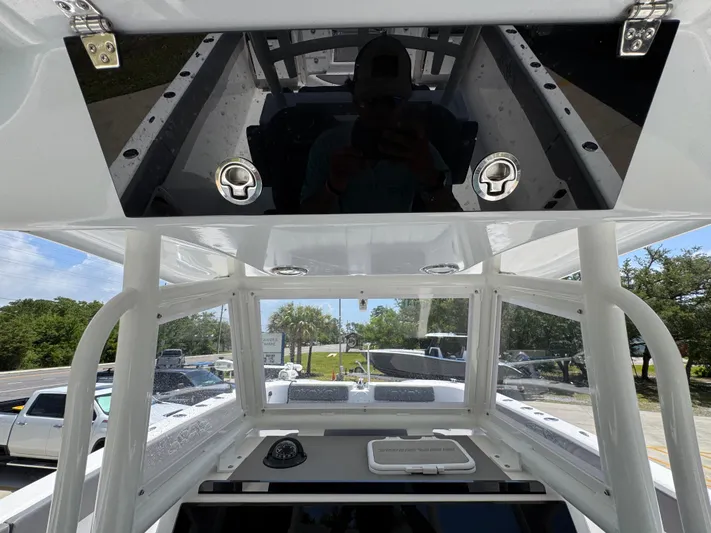  Yacht Photos Pics 2022 Twin Vee 340 GFX CC boat interior with dashboard and storage compartments.