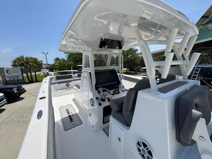  Yacht Photos Pics 2022 Twin Vee 340 GFX CC boat with modern console and seating, docked outdoors.