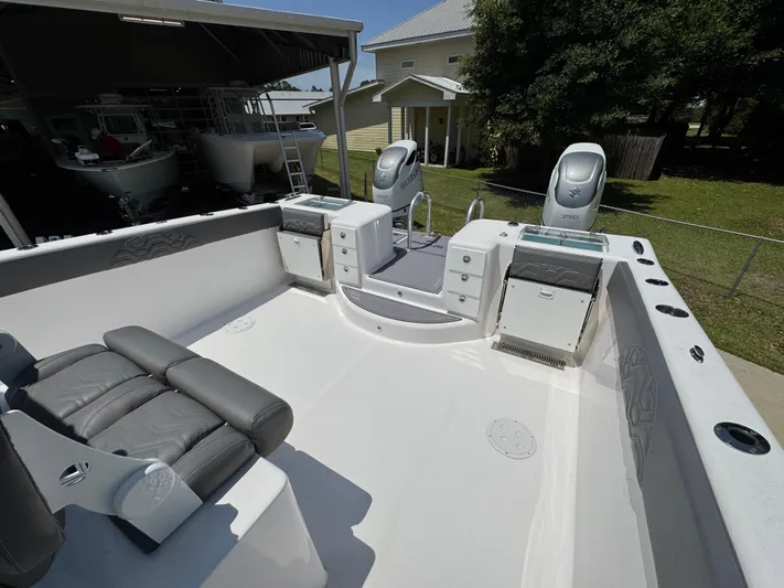  Yacht Photos Pics 2022 Twin Vee 340 GFX CC boat interior with seating and storage compartments.
