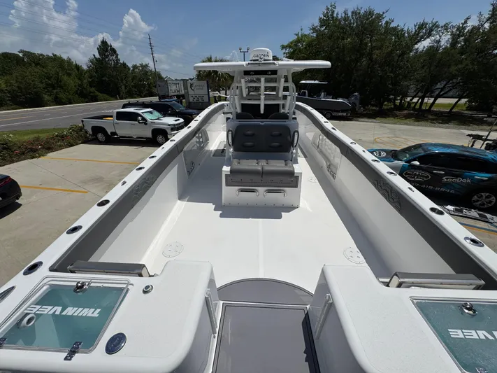  Yacht Photos Pics 2022 Twin Vee 340 GFX CC boat, spacious deck, dual seating, parked outdoors.