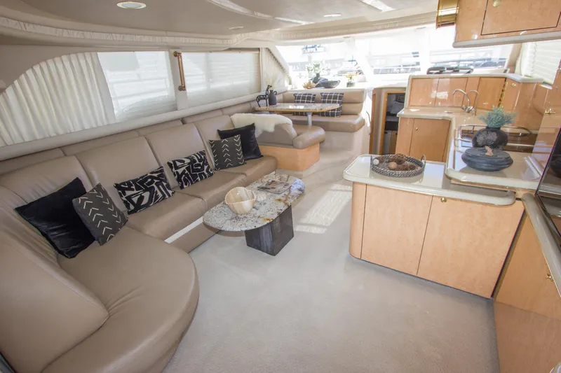 Eclipse Yacht Photos Pics Luxurious interior of 1998 Sea Ray 480 Sedan Bridge yacht with elegant seating and modern decor.