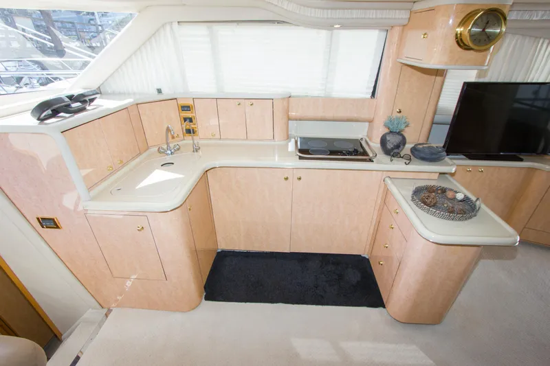 Eclipse Yacht Photos Pics Luxurious kitchen interior of 1998 Sea Ray 480 Sedan Bridge yacht with modern amenities.