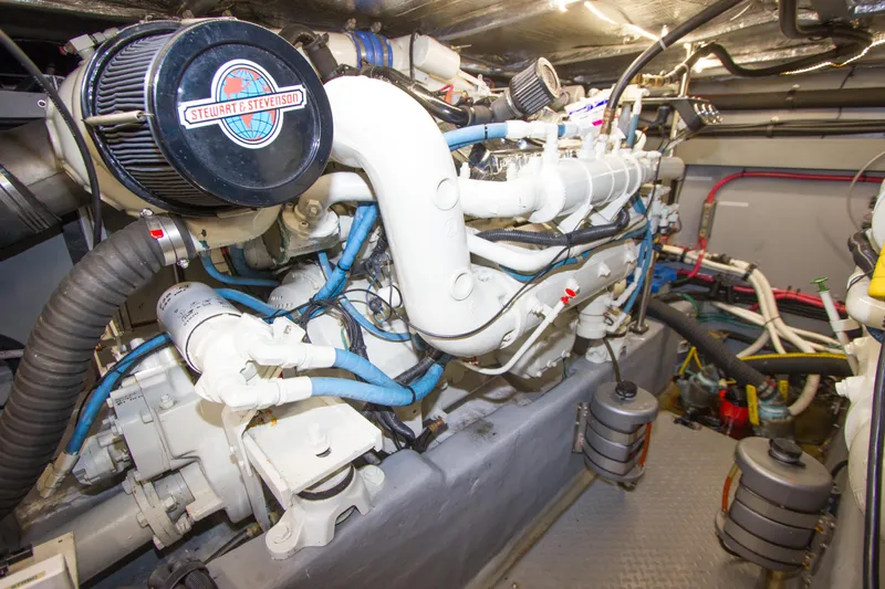 Eclipse Yacht Photos Pics Engine room of a 1998 Sea Ray 480 Sedan Bridge yacht, featuring complex machinery.