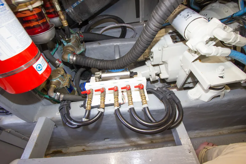 Eclipse Yacht Photos Pics Engine compartment of 1998 Sea Ray 480 Sedan Bridge with hoses and valves visible.