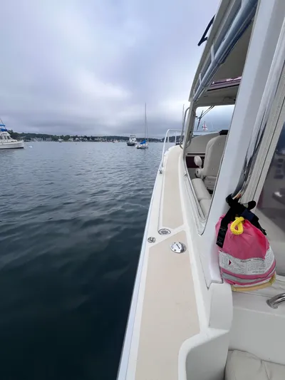 Barbican V Yacht Photos Pics 2014 MJM 36z Downeast boat on calm water, side view.