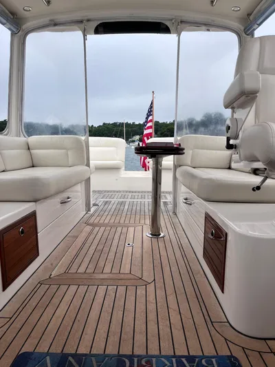 Barbican V Yacht Photos Pics 2014 MJM 36z Downeast boat interior with teak flooring and American flag.