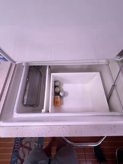 Barbican V Yacht Photos Pics Open cooler compartment on 2014 MJM 36z Downeast boat with drinks and snacks.