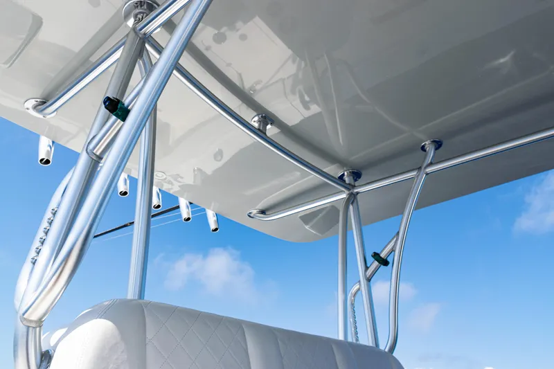  Yacht Photos Pics 2019 SeaVee 390Z boat with sleek metal framework and white cushioned seating against blue sky.