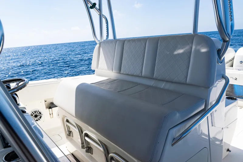  Yacht Photos Pics 2019 SeaVee 390Z boat interior with cushioned seating, ocean view in background.