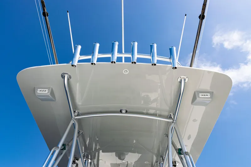  Yacht Photos Pics 2019 SeaVee 390Z boat's T-top with rod holders against a clear blue sky.