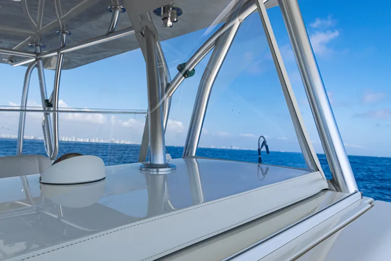  Yacht Photos Pics 2019 SeaVee 390Z boat with sleek design, ocean view, and clear blue sky.