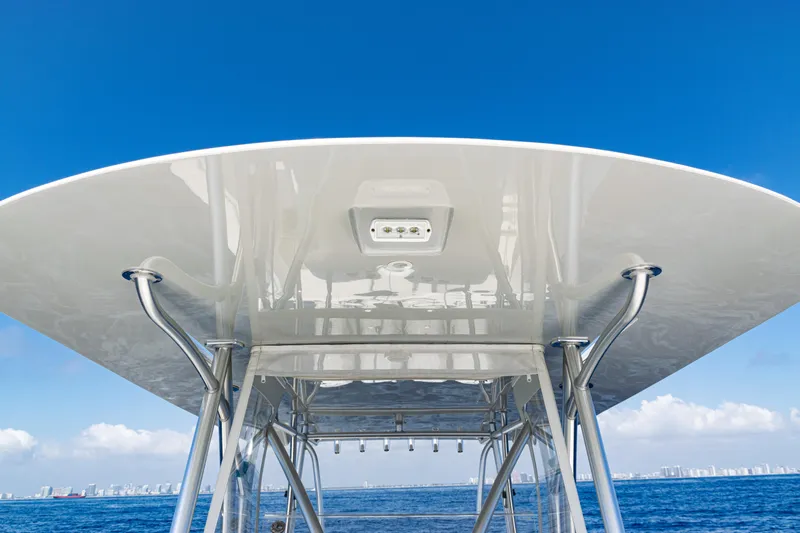  Yacht Photos Pics 2019 SeaVee 390Z boat canopy against clear blue sky and ocean backdrop.