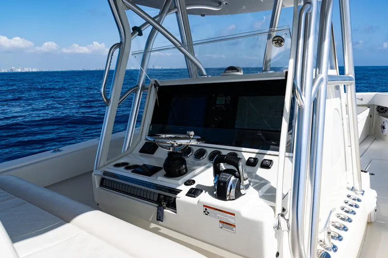  Yacht Photos Pics 2019 SeaVee 390Z boat console with ocean view, featuring modern navigation equipment.