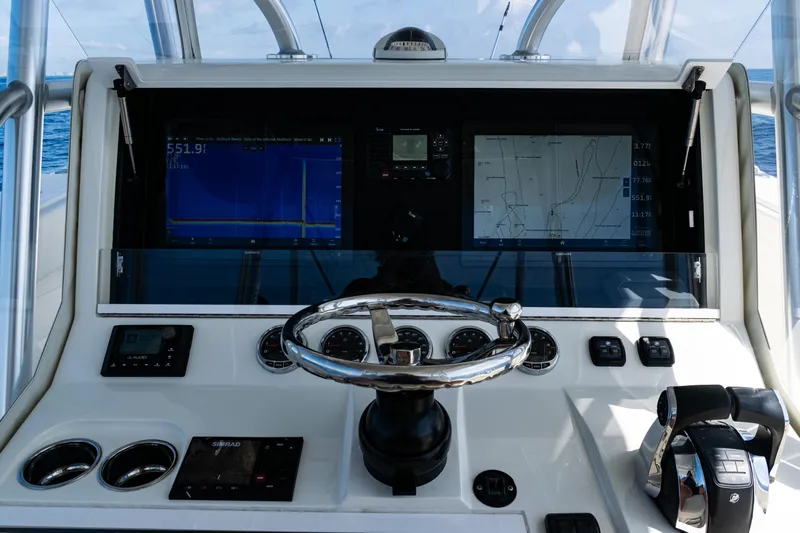  Yacht Photos Pics 2019 SeaVee 390Z helm with navigation screens and controls.