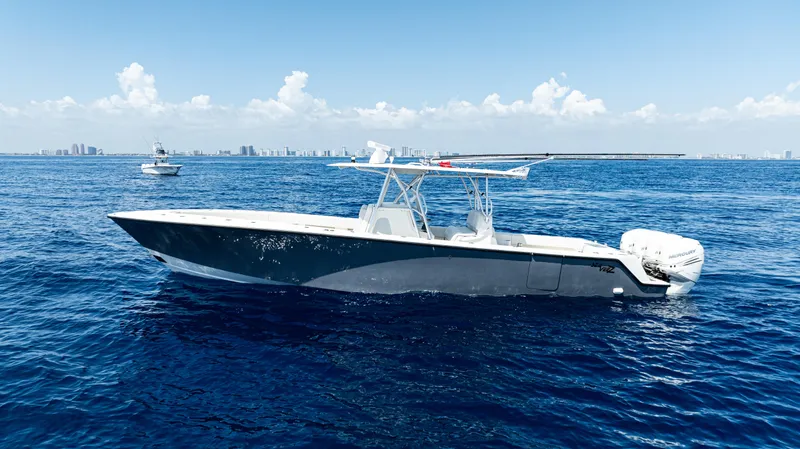  Yacht Photos Pics 2019 SeaVee 390Z boat cruising on open ocean under clear blue sky.