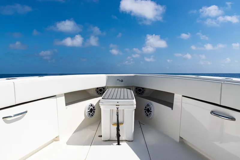  Yacht Photos Pics 2019 SeaVee 390Z boat deck with storage, speakers, and ocean view under blue sky.