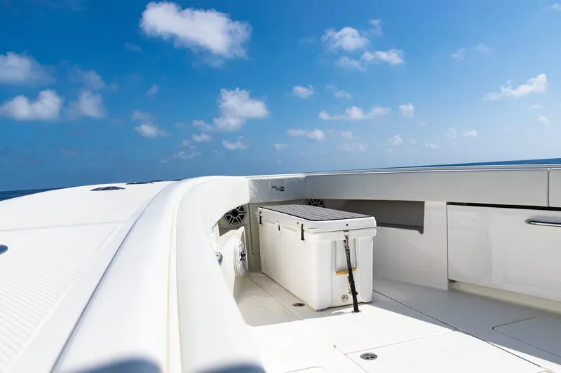  Yacht Photos Pics 2019 SeaVee 390Z boat deck with cooler under clear blue sky.