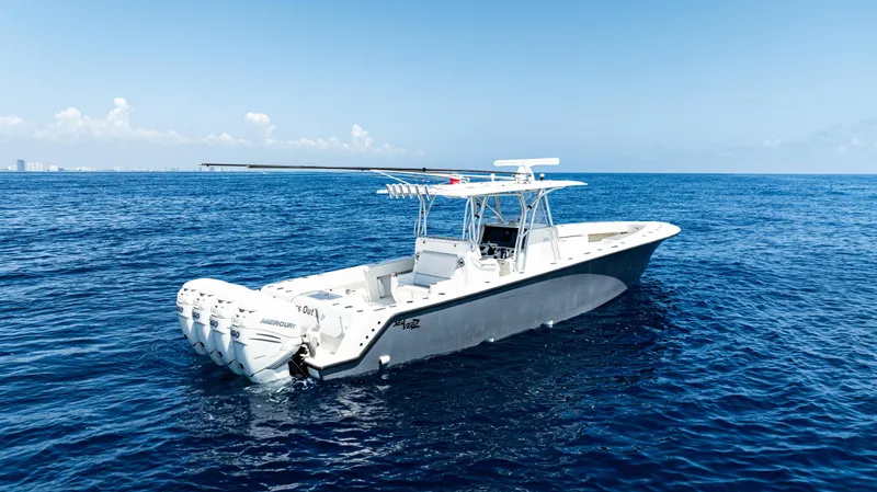  Yacht Photos Pics 2019 SeaVee 390Z boat on open ocean, clear blue sky, calm waters.