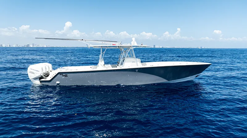  Yacht Photos Pics 2019 SeaVee 390Z boat on open ocean under clear blue sky.