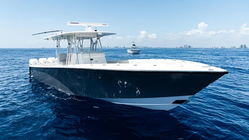  Yacht Photos Pics 2019 SeaVee 390Z boat cruising on open ocean under clear blue sky.