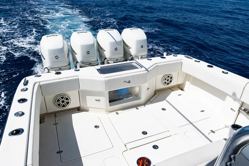  Yacht Photos Pics 2019 SeaVee 390Z boat with quad engines, spacious deck, and ocean backdrop.