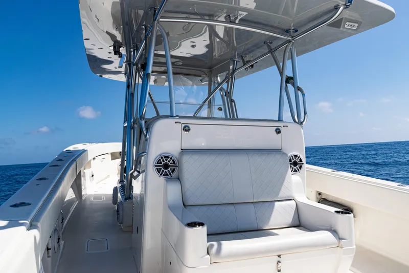  Yacht Photos Pics 2019 SeaVee 390Z boat with cushioned seating, ocean backdrop, and clear blue sky.
