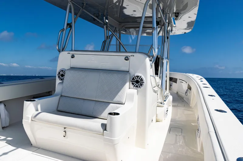  Yacht Photos Pics 2019 SeaVee 390Z boat interior with seating, ocean view, and clear blue sky.
