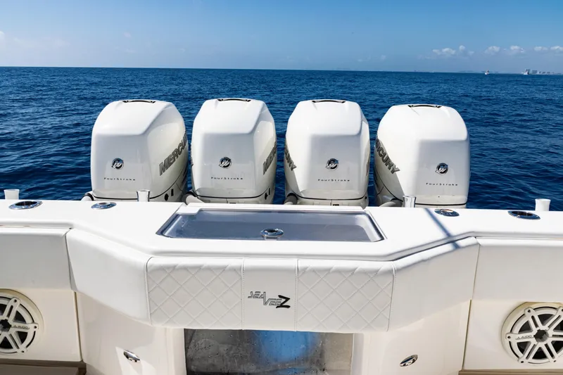  Yacht Photos Pics 2019 SeaVee 390Z boat with four powerful Mercury outboard engines on open sea.