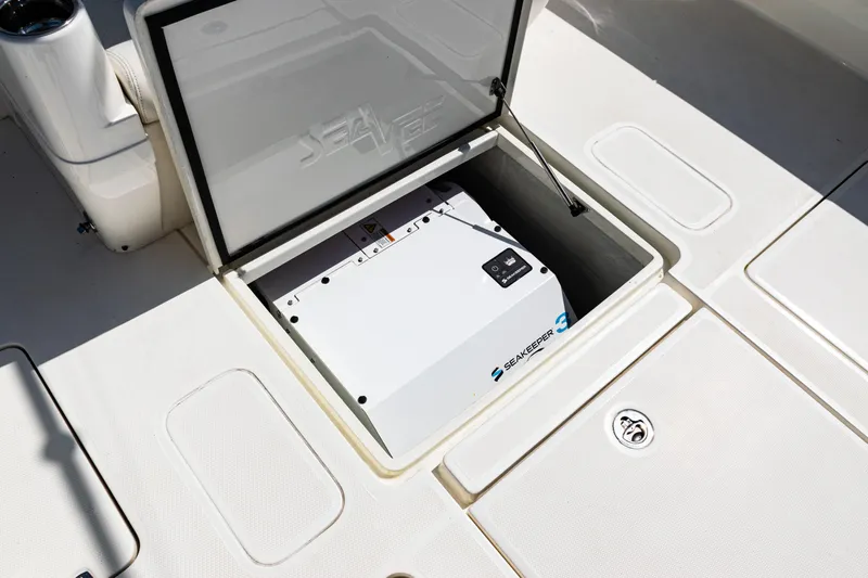  Yacht Photos Pics 2019 SeaVee 390Z boat storage compartment with open hatch, revealing equipment inside.