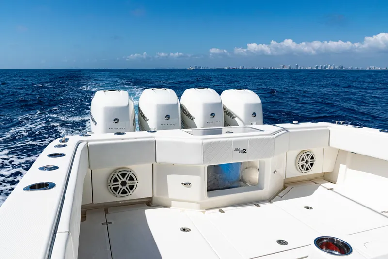  Yacht Photos Pics 2019 SeaVee 390Z boat with four engines cruising on open ocean under clear blue sky.