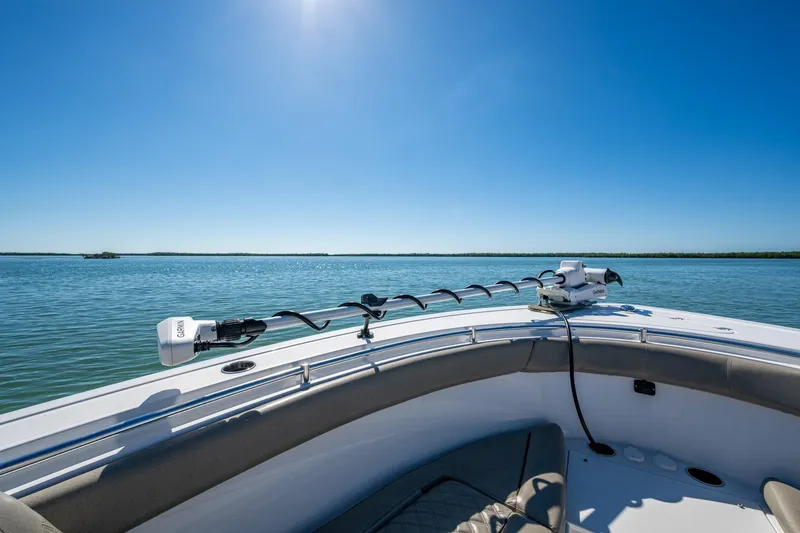 Yacht Photos Pics 2023 Sportsman Open 302 Center Console on calm water under clear blue sky.