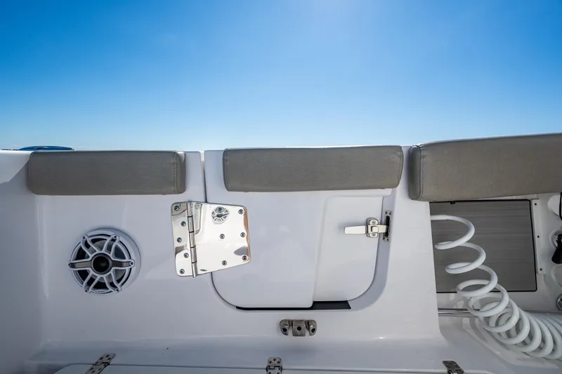  Yacht Photos Pics 2023 Sportsman Open 302 Center Console boat interior with speaker and storage compartment.