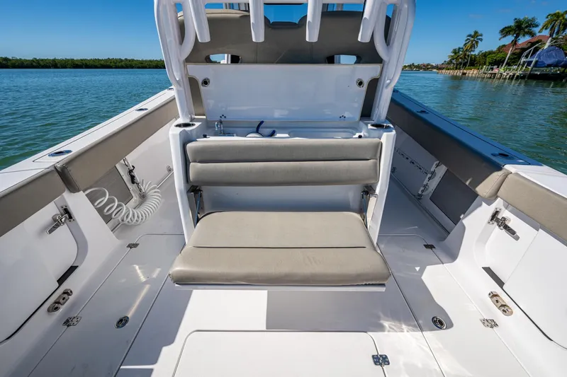  Yacht Photos Pics 2023 Sportsman Open 302 Center Console boat interior with seating, on a sunny day.