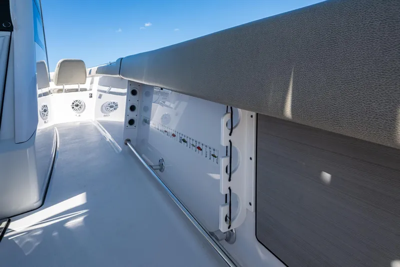  Yacht Photos Pics 2023 Sportsman Open 302 Center Console interior with seating and storage features.