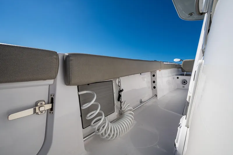  Yacht Photos Pics 2023 Sportsman Open 302 Center Console boat interior with sleek design and blue sky.