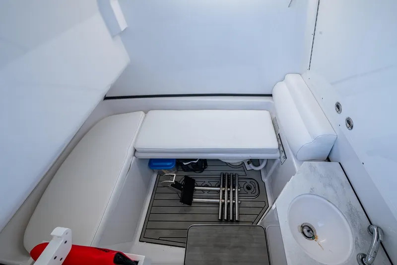  Yacht Photos Pics 2023 Sportsman Open 302 Center Console interior with seating and sink.