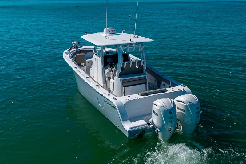  Yacht Photos Pics 2023 Sportsman Open 302 Center Console boat on clear blue water.