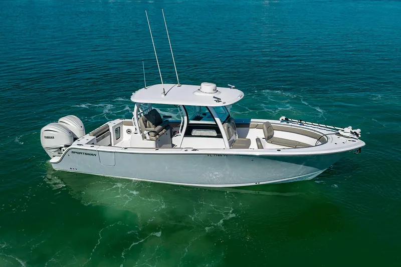  Yacht Photos Pics 2023 Sportsman Open 302 Center Console boat on clear blue water.