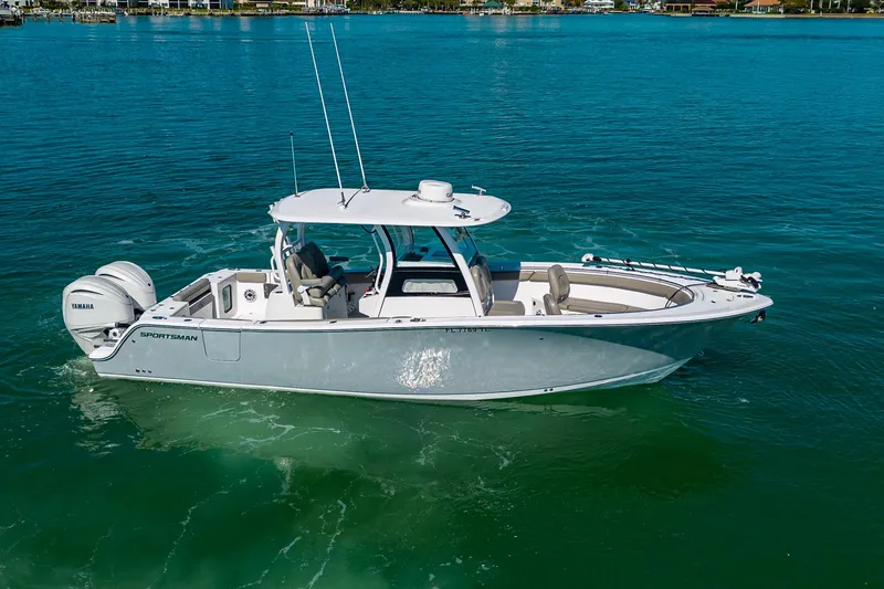  Yacht Photos Pics 2023 Sportsman Open 302 Center Console boat on clear blue water.