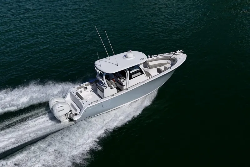  Yacht Photos Pics 2023 Sportsman Open 302 Center Console boat cruising on open water.