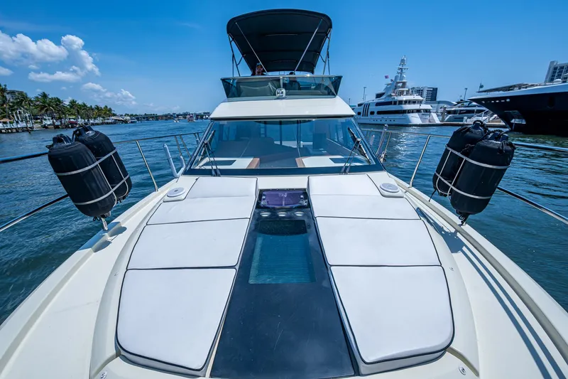 Blue B Yacht Photos Pics 2015 Beneteau Monte Carlo yacht on water, showcasing sleek design and luxurious deck.