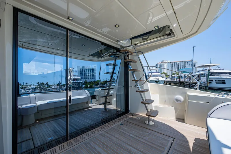 Blue B Yacht Photos Pics Luxurious 2015 Beneteau Monte Carlo yacht deck with modern design and marina view.